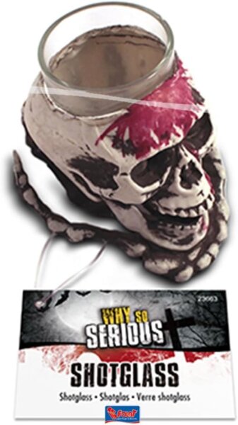 Totenkopf auf einer Skelett Hand mit Shot Glas